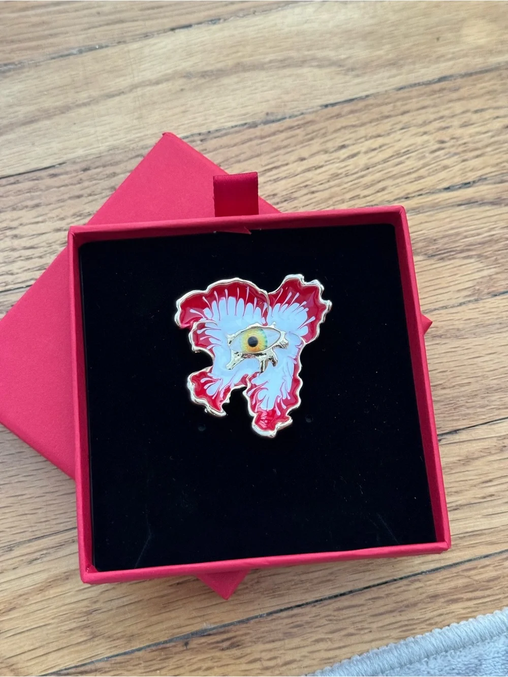 Uniqlo Red and White Enamel Eye Brooch with Gold Trim